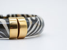 Armreif mit goldenem Akzent