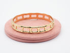 Edelstahlarmreif mit offenem Design Gold