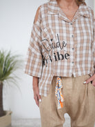 ausgefallene Bluse in kariert mit Cut Outs