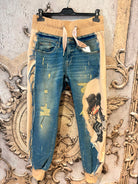 ausgefallene Hose mit Jeans Elementen und großem Motiv Variante Comic